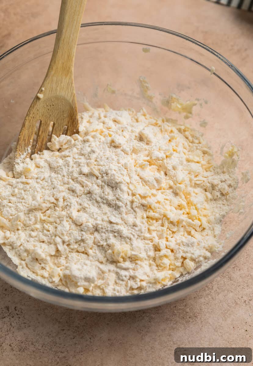 Honey Biscuits Recipe: Soft, Buttery Honey Biscuits in 30 Minutes 5 Grated butter combined with flour and dry ingredients.