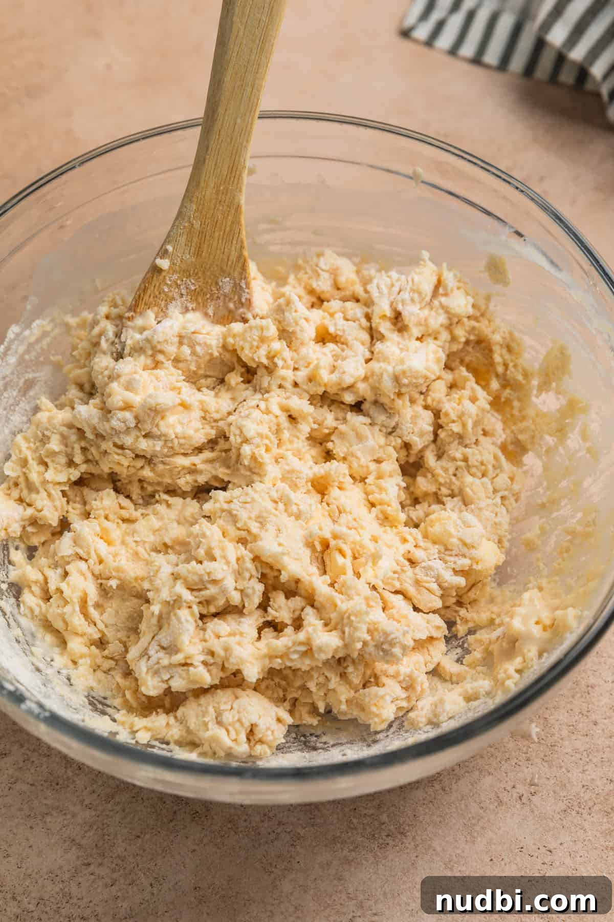 Honey Biscuits Recipe: Soft, Buttery Honey Biscuits in 30 Minutes 7 Honey biscuit dough mixture in glass mixing bowl.