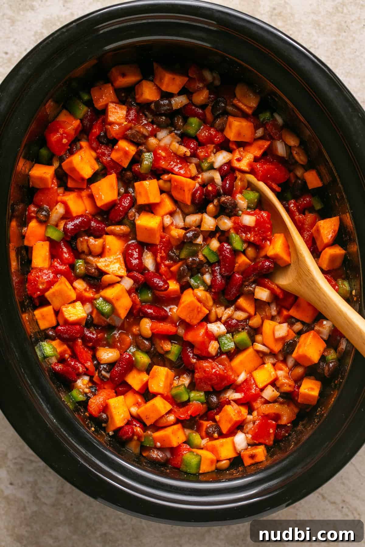 Slow Cooker Sweet Potato and Black Bean Chili Recipe 5 Slow cooker sweet potato chili ingredients in crockpot stirred before cooking.