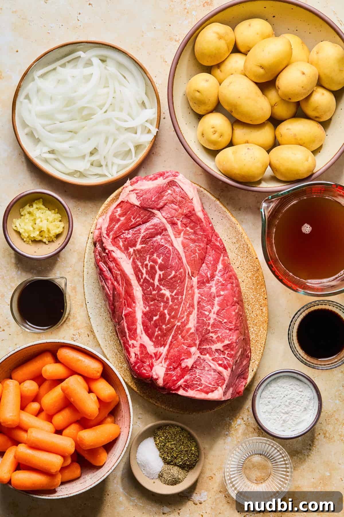 Slow-Cooked Chuck Roast Recipe for Tender, Juicy Beef 4 Chuck roast, potatoes, carrots, onion and other ingredients needed for recipe.