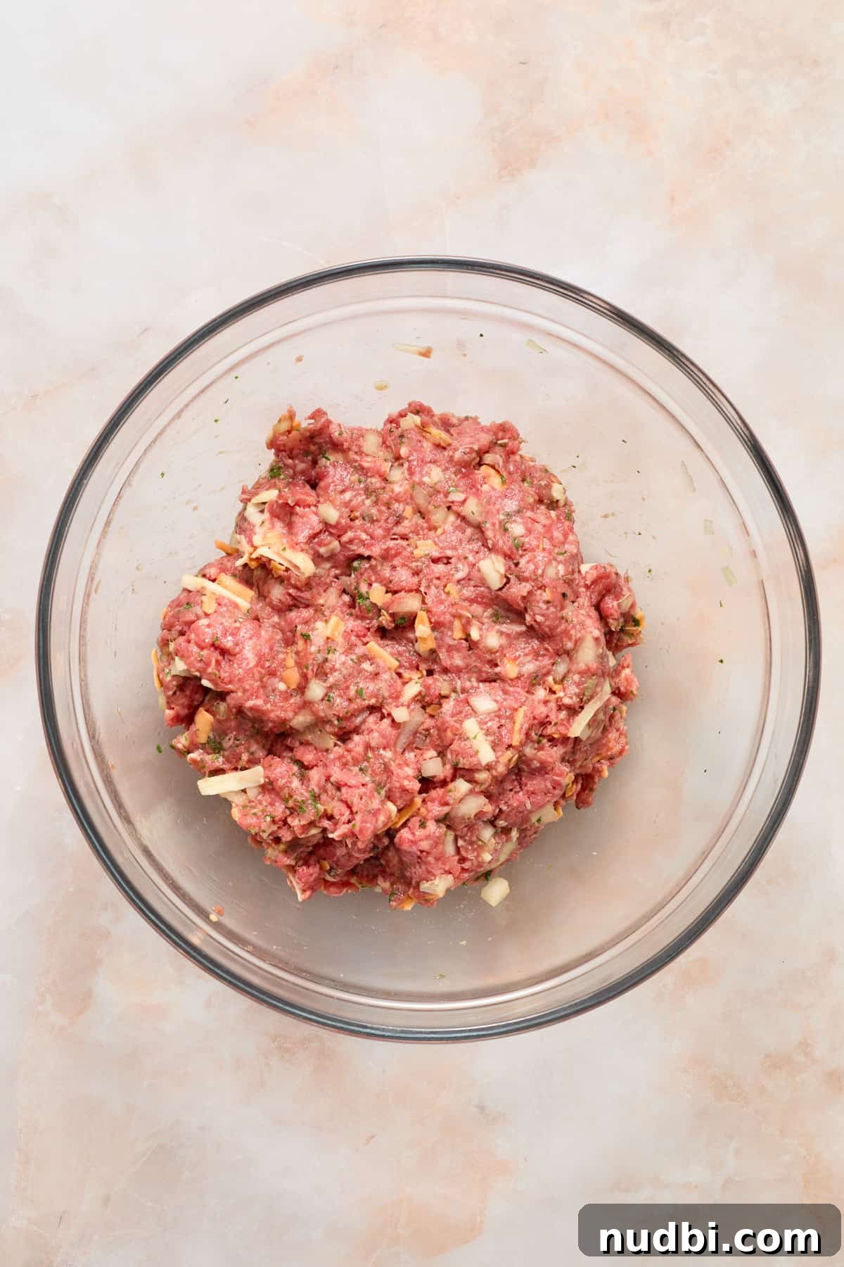 Crispy Air Fryer Hamburgers: Juicy Patties in Minutes 5 Hamburger mixture in glass bowl.