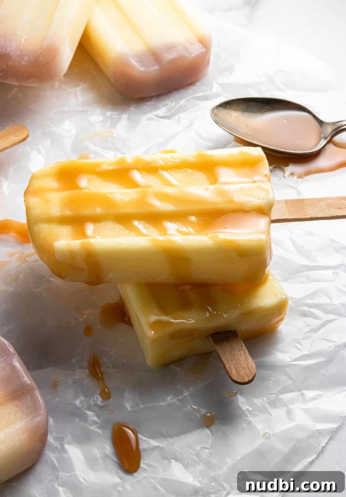 Homemade Jello Pudding Pops: Creamy Frozen Treat Recipe 2 Pudding pop stack with caramel drizzle.