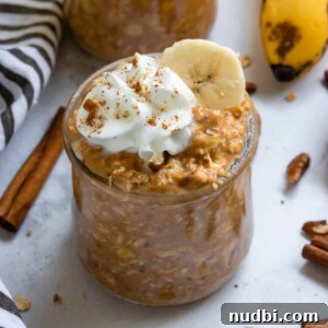 Pumpkin Banana Overnight Oats Recipe for Fall Breakfast 4 Pumpkin banana overnight oats in jar with whipped cream and cinnamon.