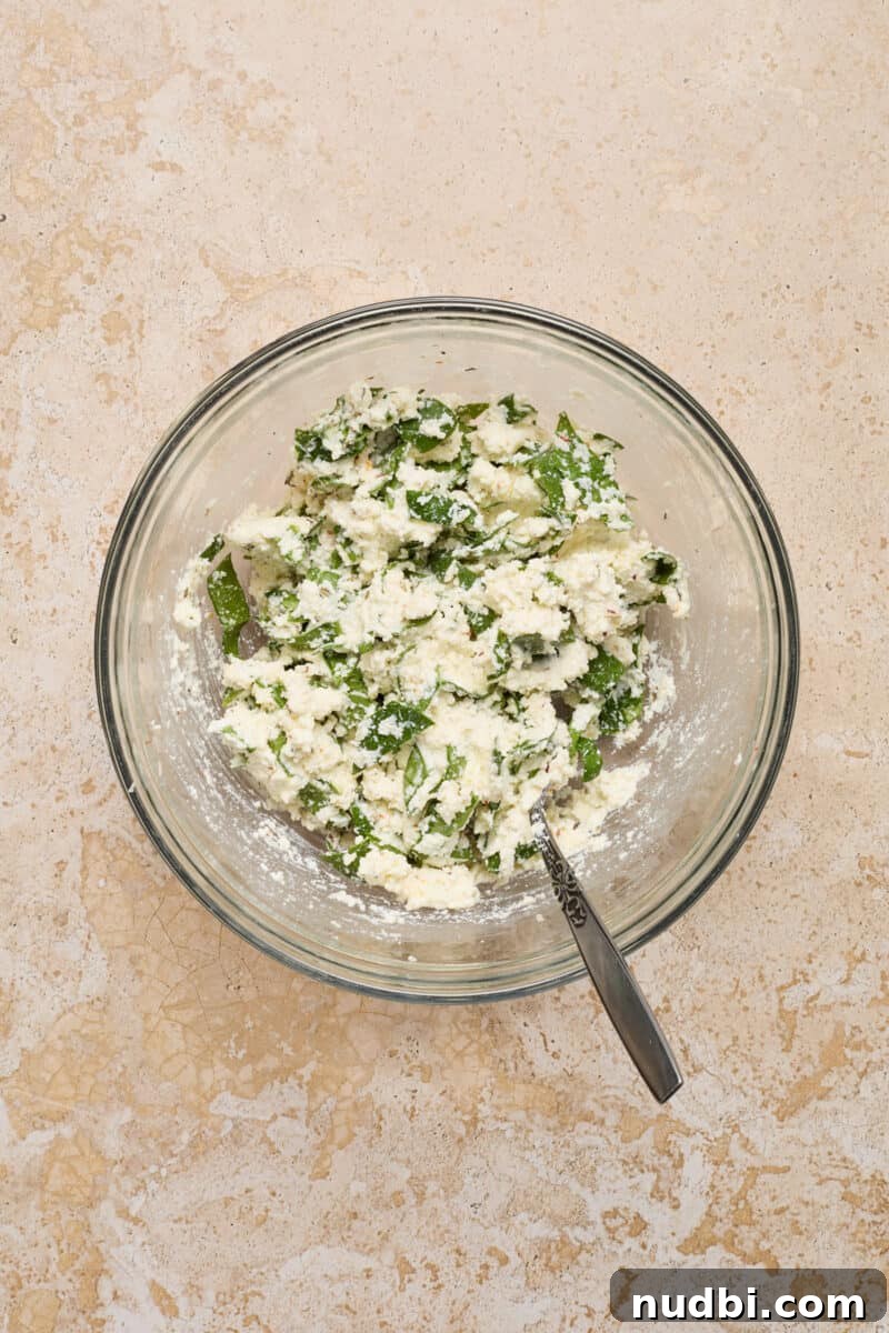 Spinach and Ricotta Stuffed Chicken Breast Recipe 4 Ricotta, spinach and ingredients in bowl.