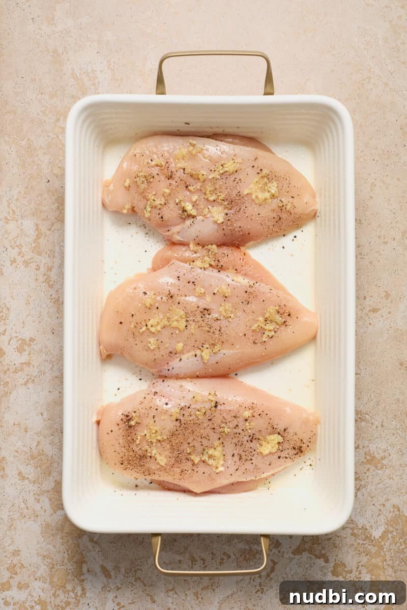 Spinach and Ricotta Stuffed Chicken Breast Recipe 5 Seasoned chicken in casserole dish.