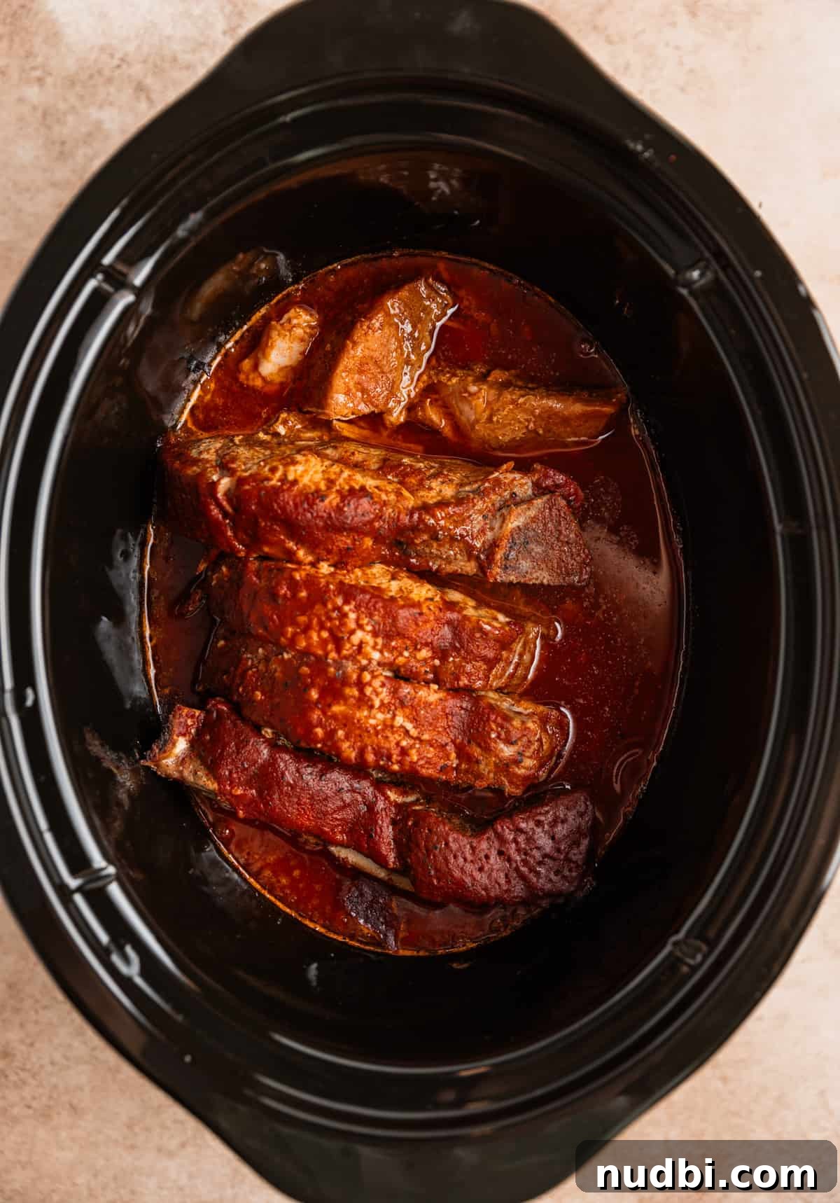 Slow-Cooker Country-Style BBQ Ribs: Tender, Fall-Off-the-Bone Recipe 8 Cooked country style ribs in crock pot with BBQ sauce.
