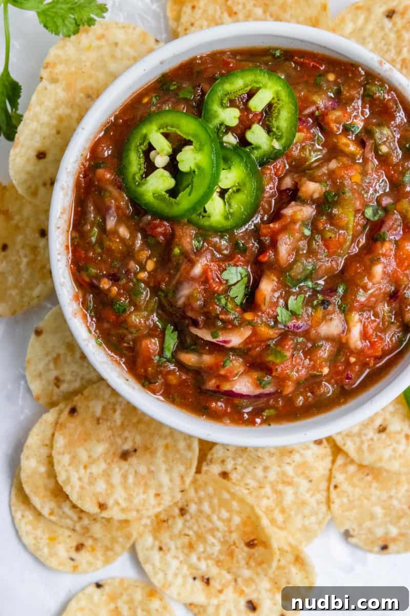 Smoky Roasted Tomato Salsa Recipe for Fresh Homemade Salsa 7 Overhead shot of bowl of roasted tomato salsa with chips.