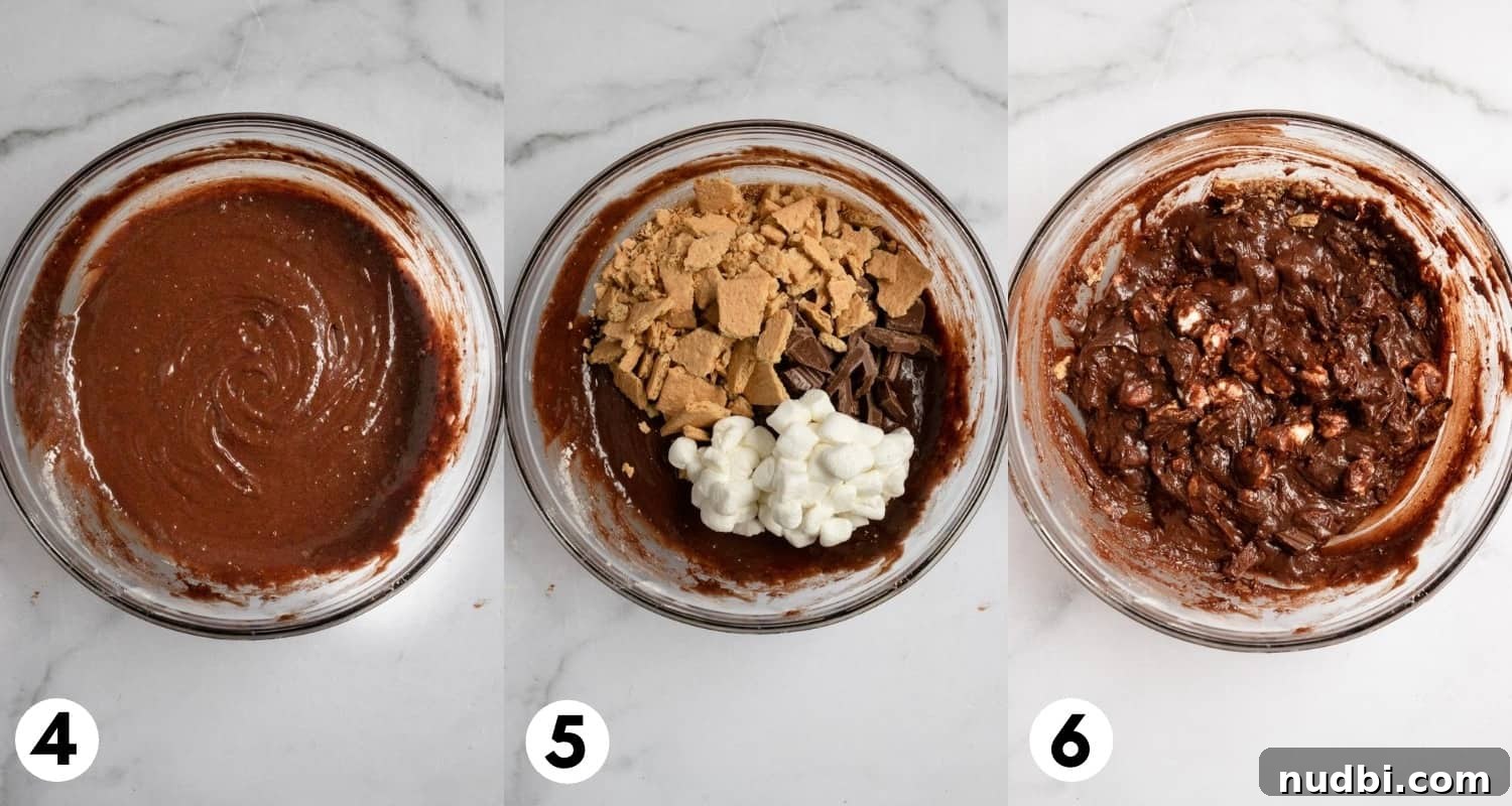 Skillet S'mores Brownie Recipe: Gooey Campfire Dessert 5 Brownie batter with graham crackers, marshmallows and chocolate bars.