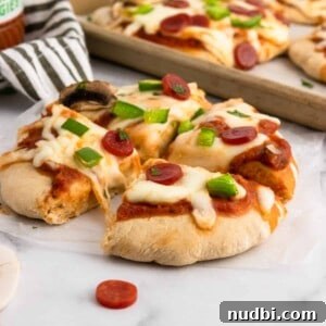 Whole Wheat Mini Veggie-Packed Pizzas for Kids 10 Whole wheat pizza dough baked with toppings.