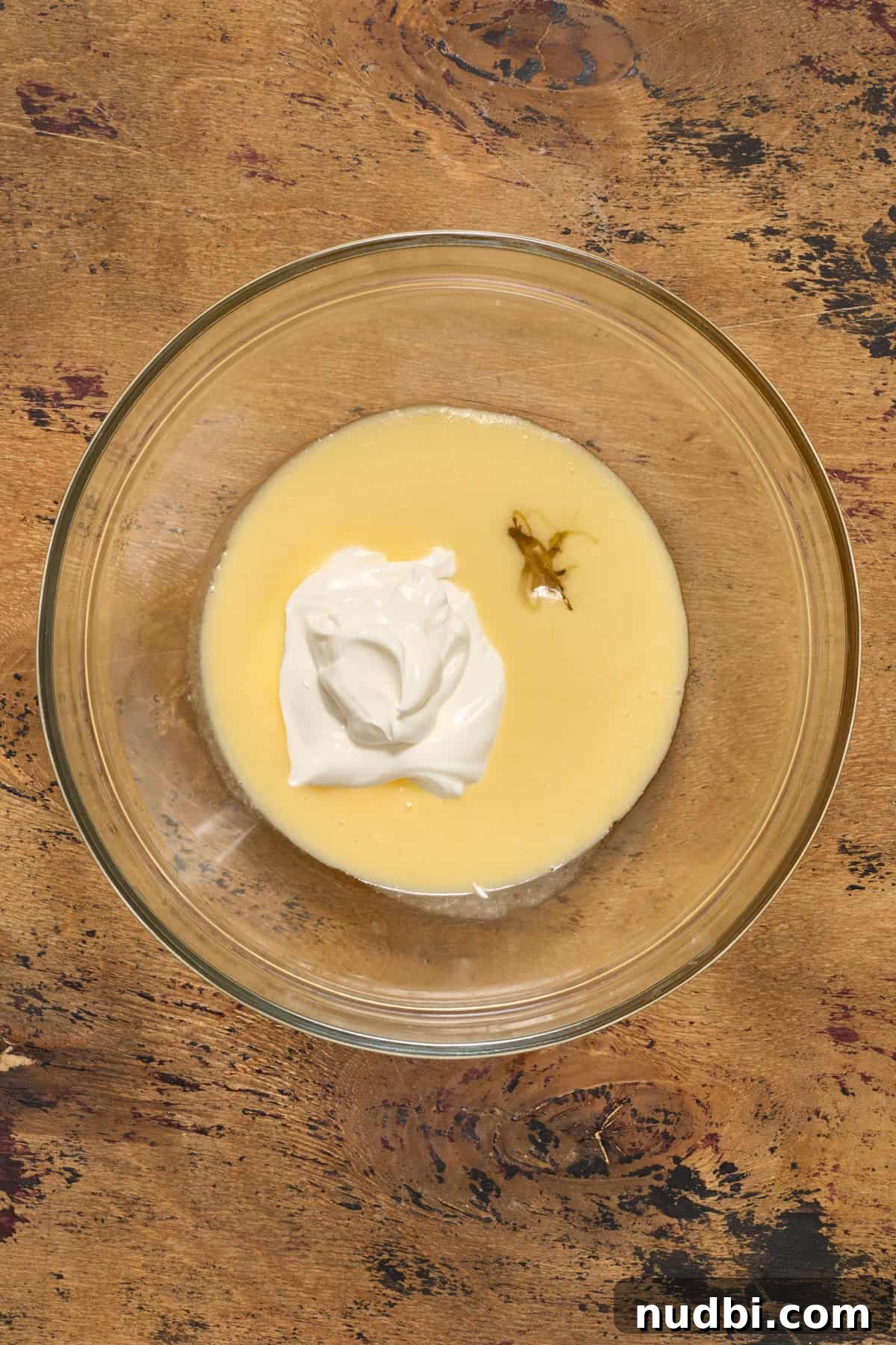 Sweet Honey Cornbread Casserole Recipe for Comforting Family Meals 5 Butter and egg whisked together and then honey and sour cream added.