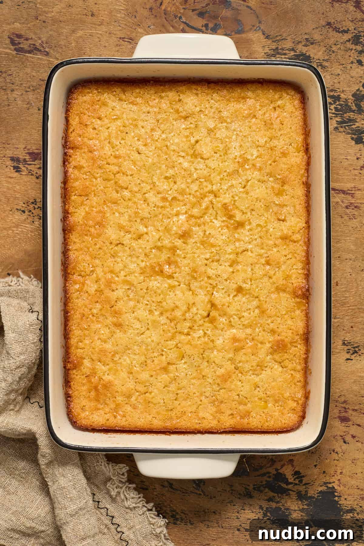 Sweet Honey Cornbread Casserole Recipe for Comforting Family Meals 10 Baked honey cornbread casserole in baking pan.