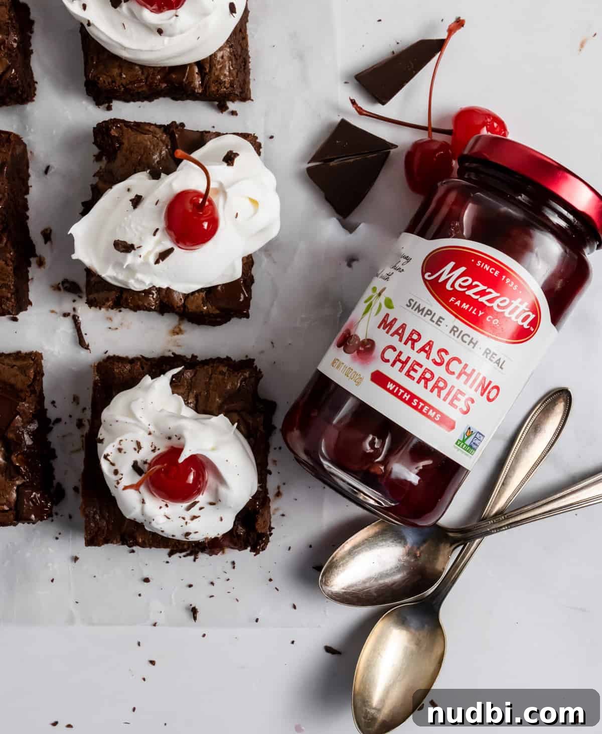 Decadent Dark Chocolate Cherry Brownie Recipe 8 Cherry brownies with jar of cherries.