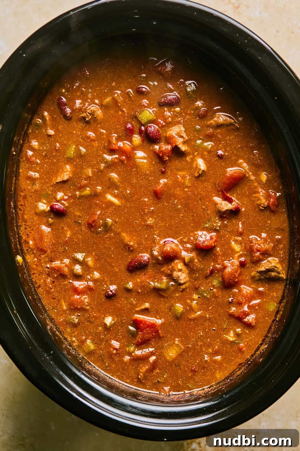 Slow Cooker Beef Brisket Chili Recipe for Tender, Smoky Flavor 10 Crockpot chili prepared in slow cooker.