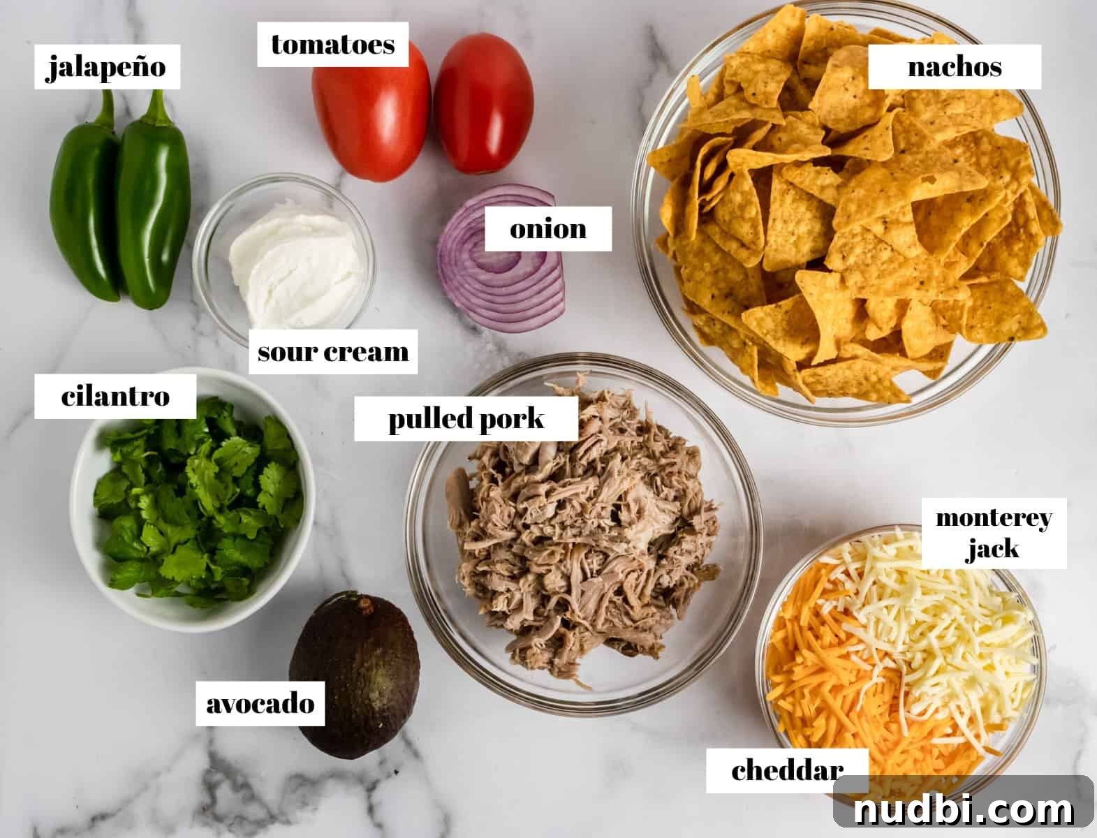 Ultimate Pulled Pork Nachos Recipe for Game Day Crowd 3 Labeled Nacho Ingredients on counter labeled.