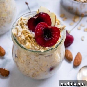 Creamy Vegan Overnight Oats Recipe for Quick Plant-Based Breakfast 5 Cherry Overnight Oats with sliced cherry and almonds.