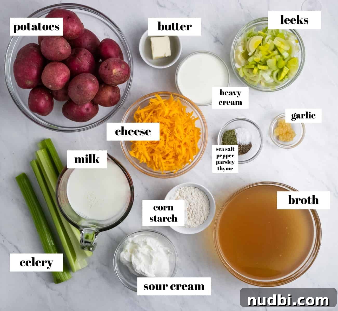 Creamy Instant Pot Potato and Leek Soup Recipe 3 Potatoes, cheese, celery, cream and other soup ingredients labeled.