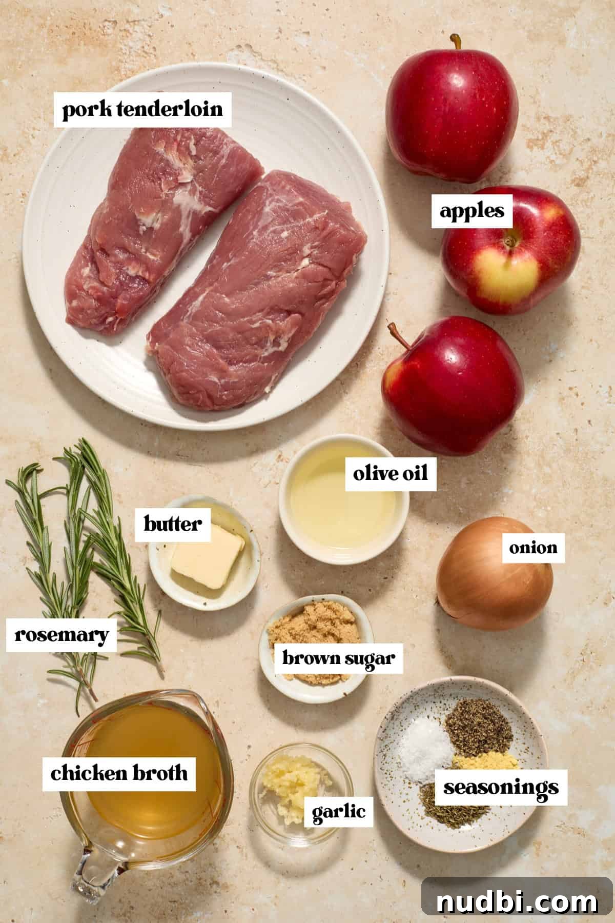 Juicy Instant Pot Pork Tenderloin Recipe for Quick Dinners 4 Pork, butter, apple, rosemary and other ingredients labeled on surface.