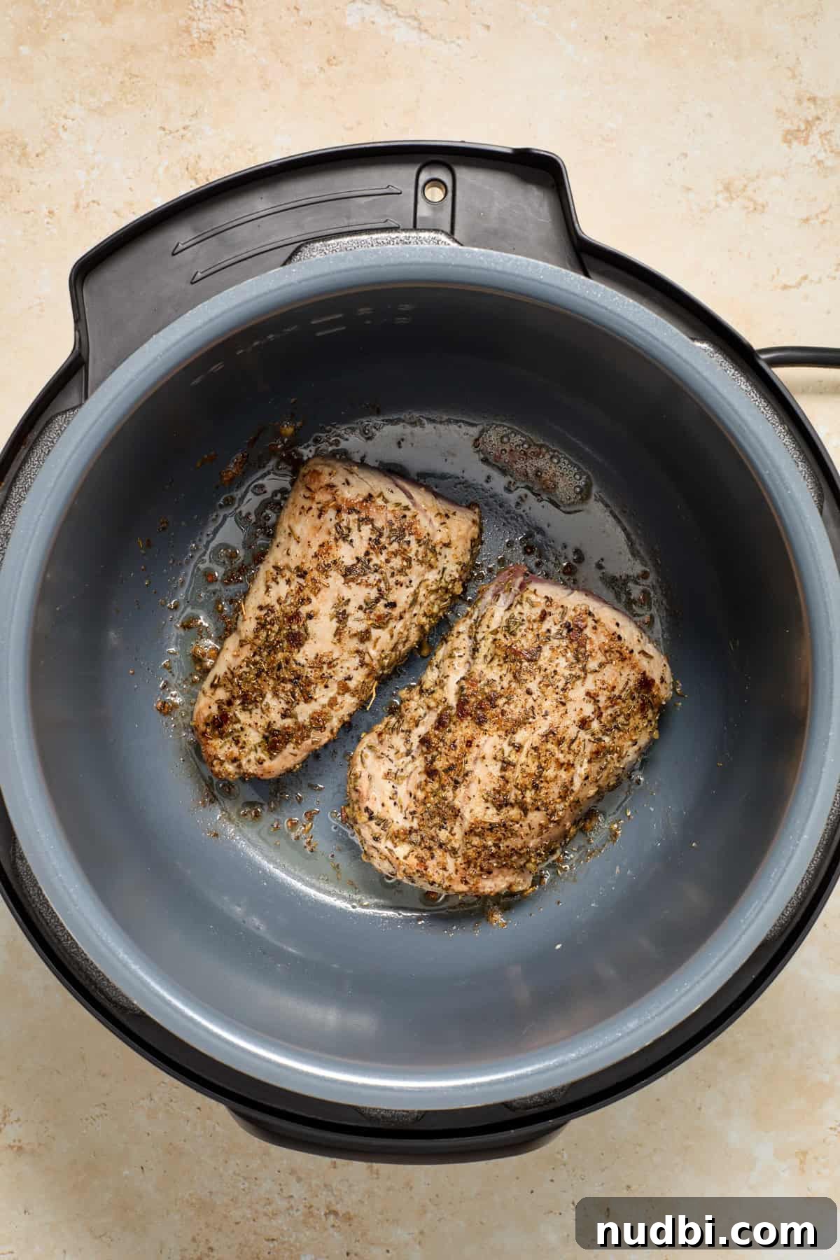Juicy Instant Pot Pork Tenderloin Recipe for Quick Dinners 7 Seared pork tenderloin in Instant pot.