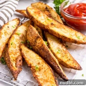 Crispy Air Fryer Potato Wedges Recipe for Perfect Sides 9 Crispy air fried potato wedges with ketchup.