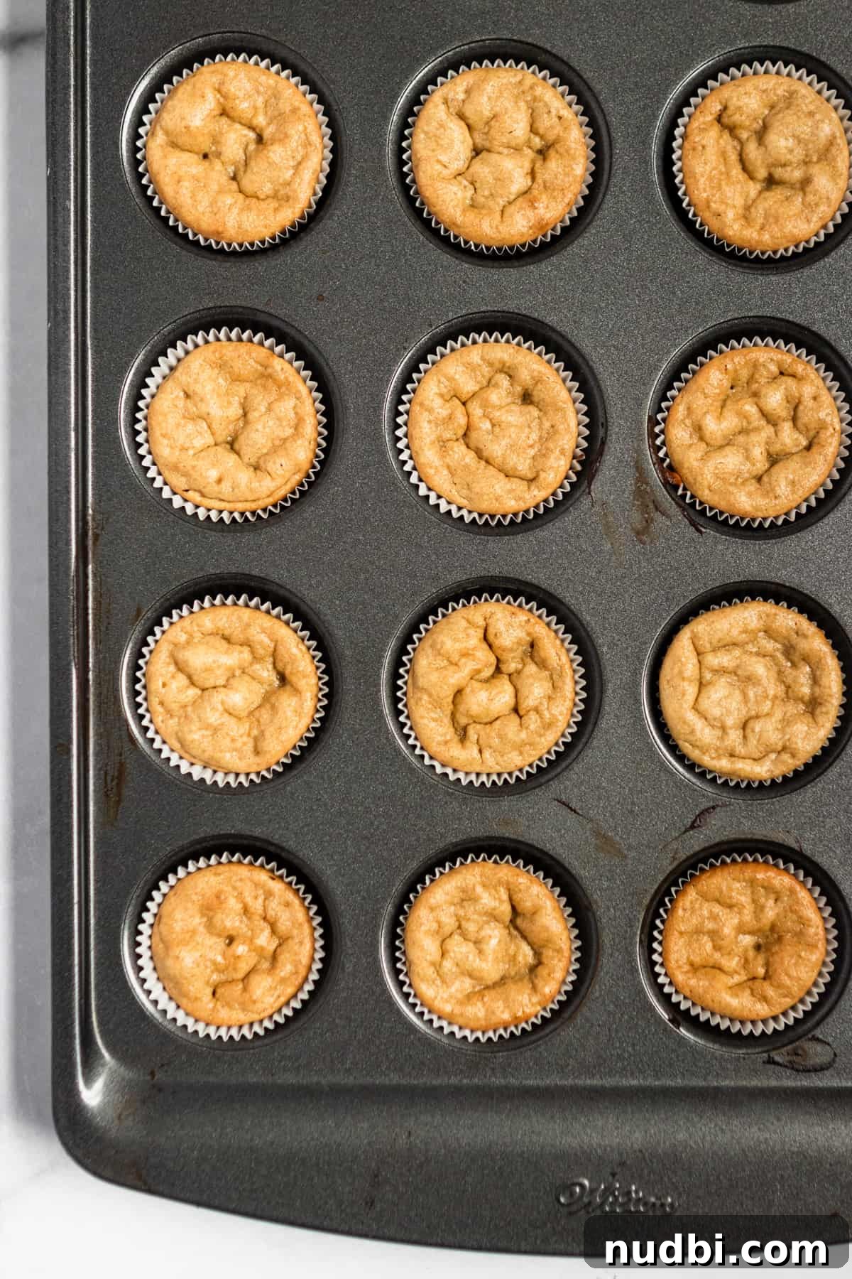Peanut Butter Banana Mini Muffins (Flourless, Gluten-Free) 5 Baked muffins in mini muffin tin.