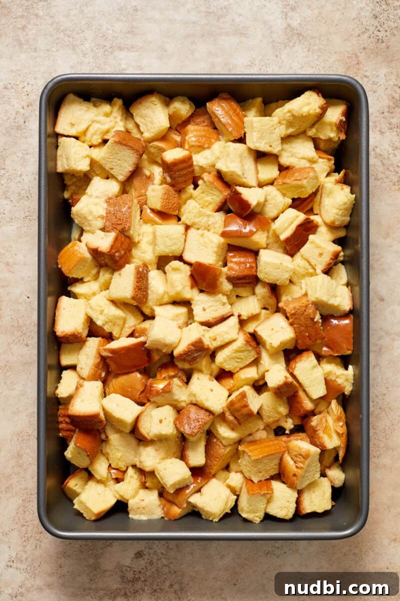 Cinnamon Roll Baked French Toast Recipe for Brunch 7 French toast casserole in baking pan before baking.