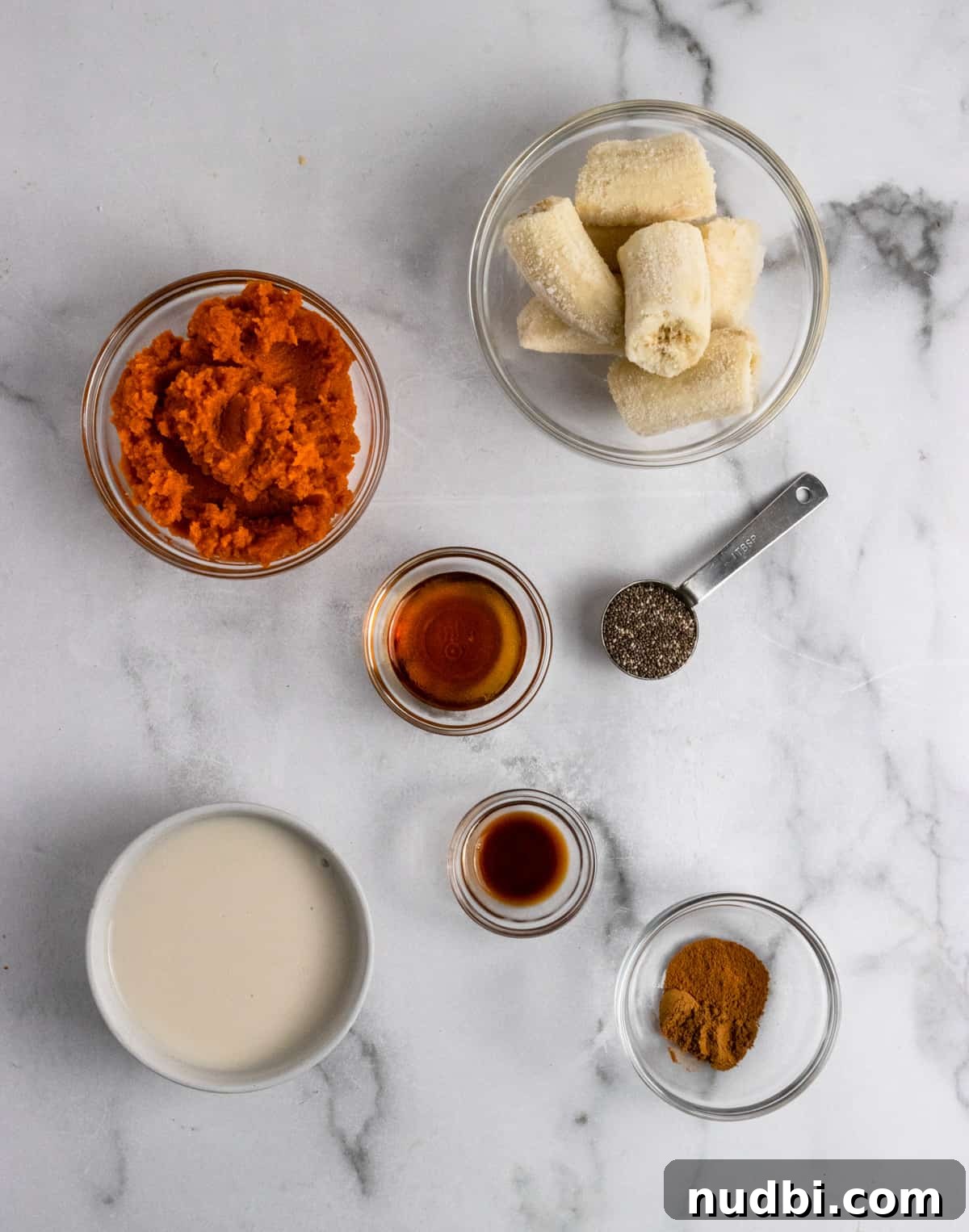Pumpkin Pie Smoothie Recipe for Creamy Fall Breakfast 4 Recipe ingredients on counter.