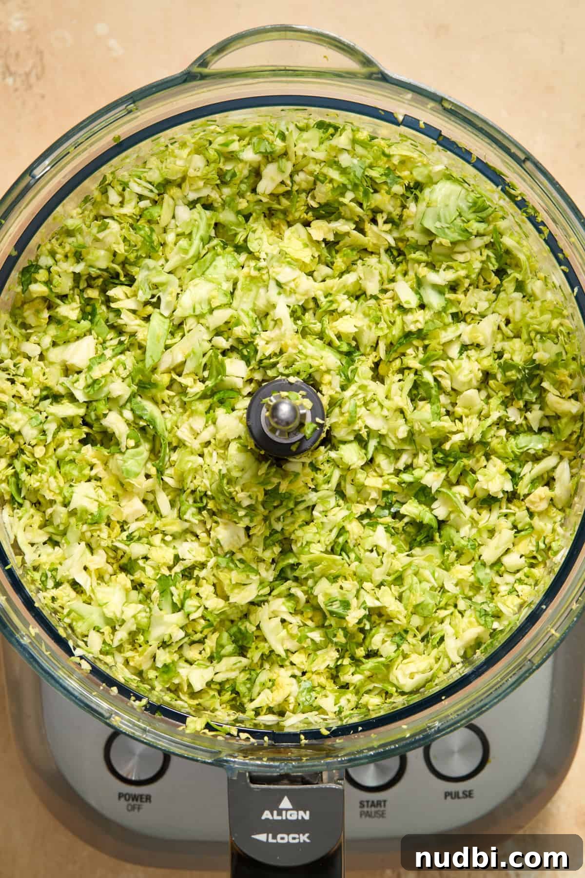 Crisp Shaved Brussels Sprout Salad with Lemon Parmesan Dressing 5 Shredded Brussel sprouts in food processor.