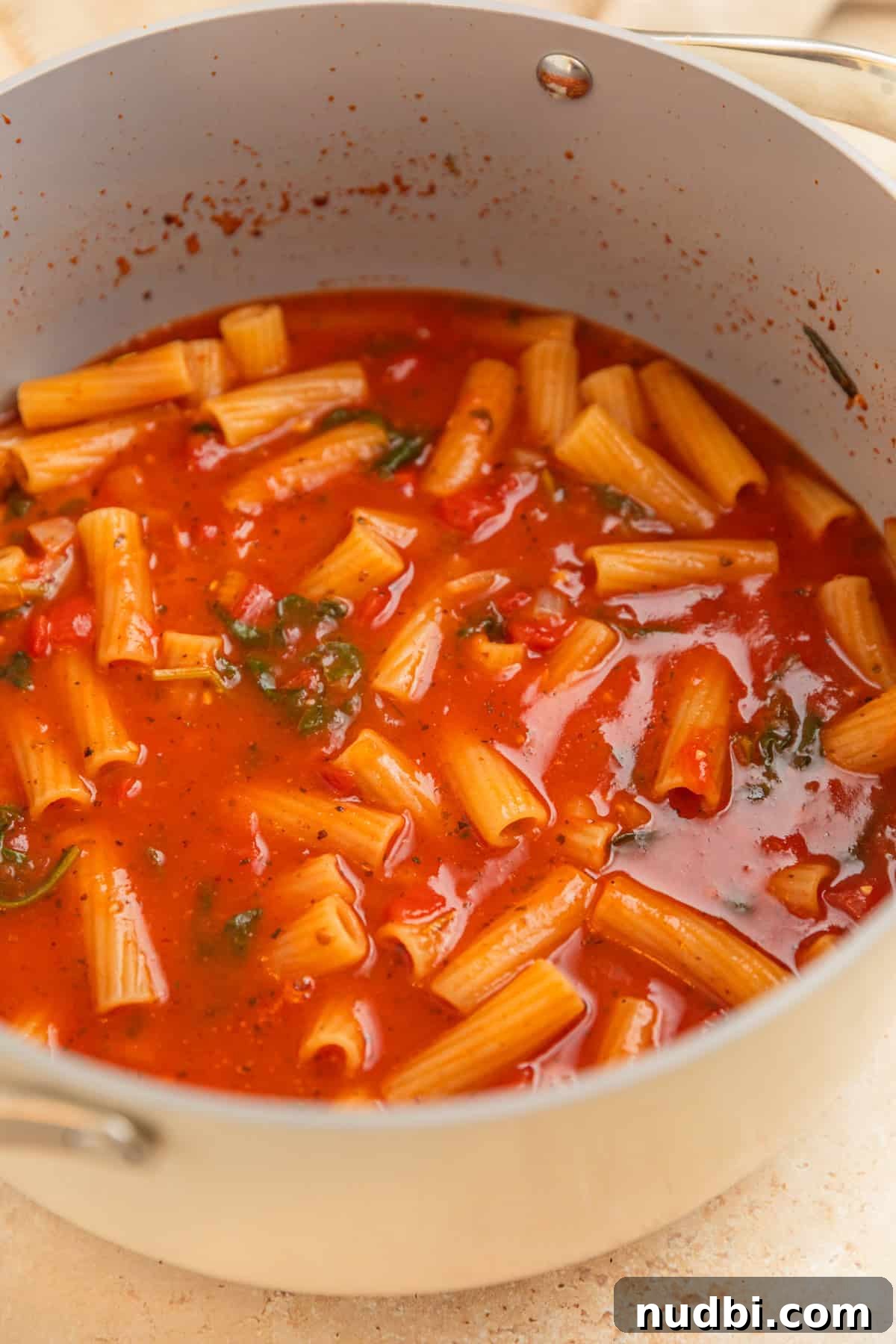 Creamy One-Pot Pasta Recipe for Quick Weeknight Meals 5 Pot with boiled pasta in sauce.