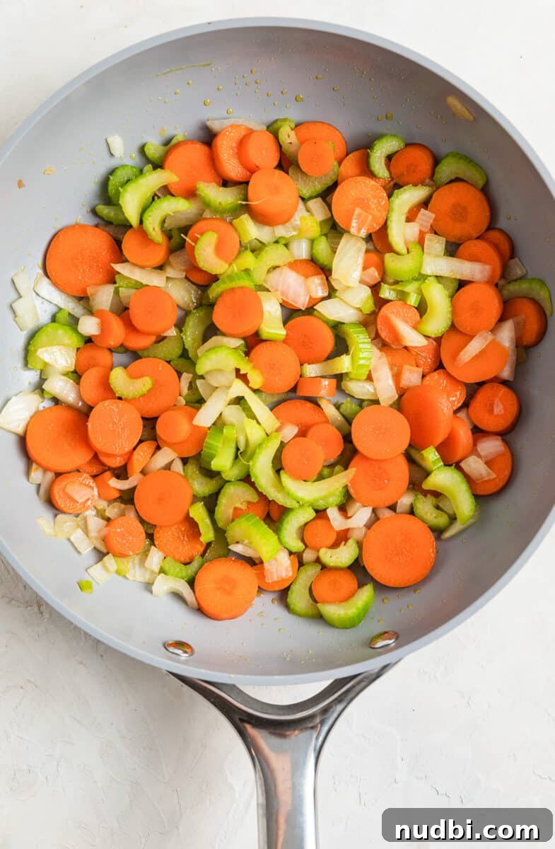 One-Pan Chicken and Biscuits Skillet Recipe 4 Carrots, celery and onions sautéed in skillet.