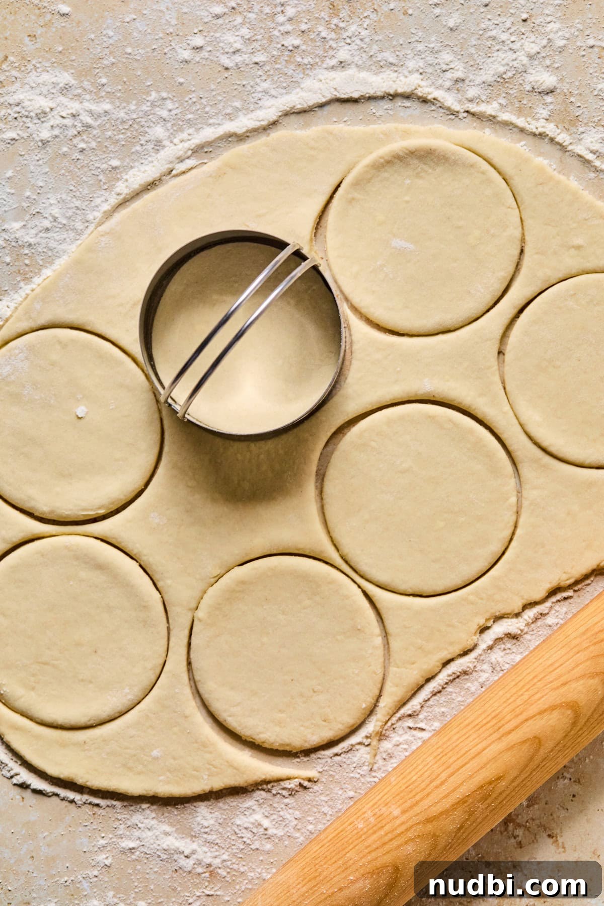 Air Fryer Blueberry Hand Pies Recipe 12 Biscuit cutter pressed into dough to make circles.