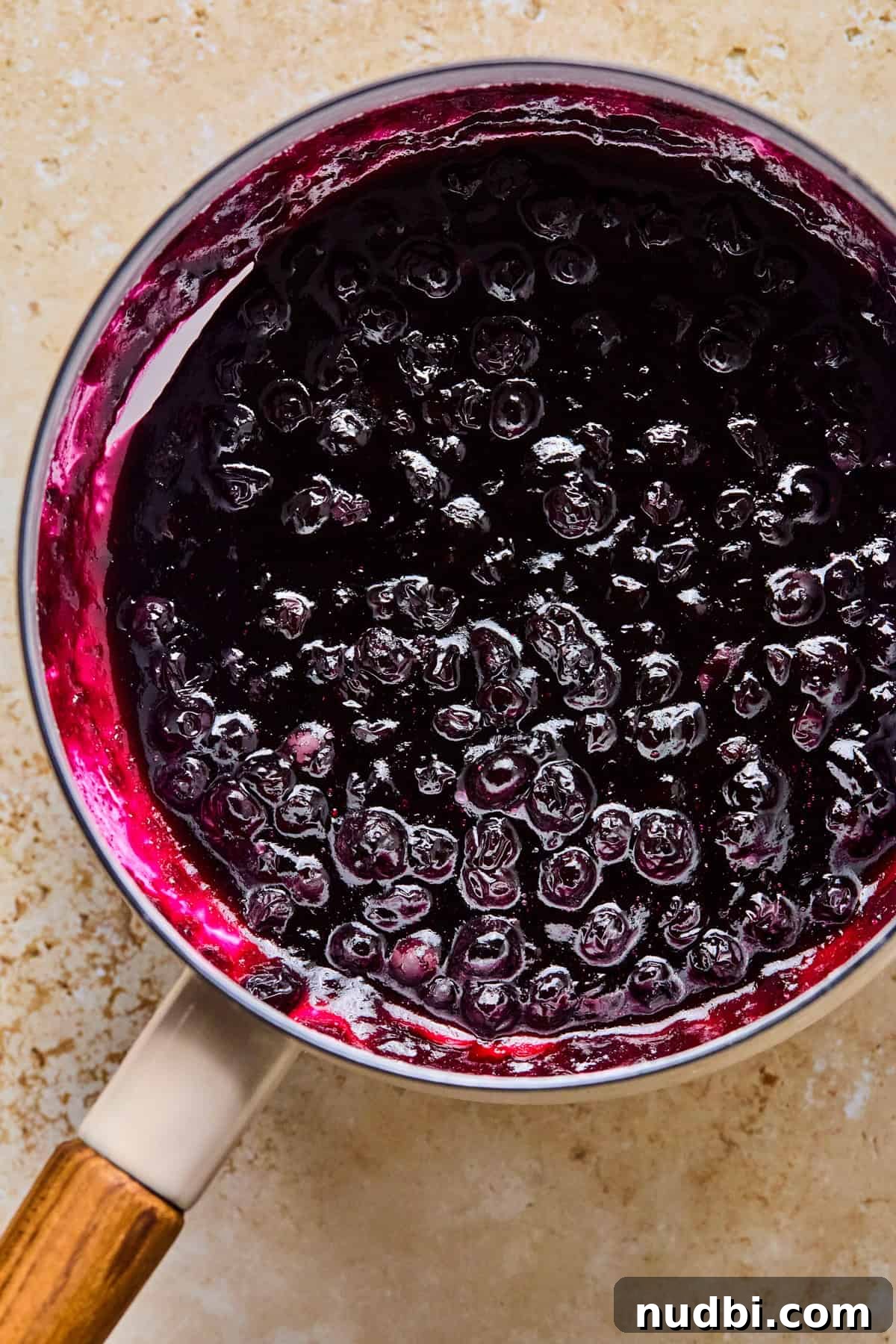 Air Fryer Blueberry Hand Pies Recipe 10 Blueberry sauce thickened in pot.