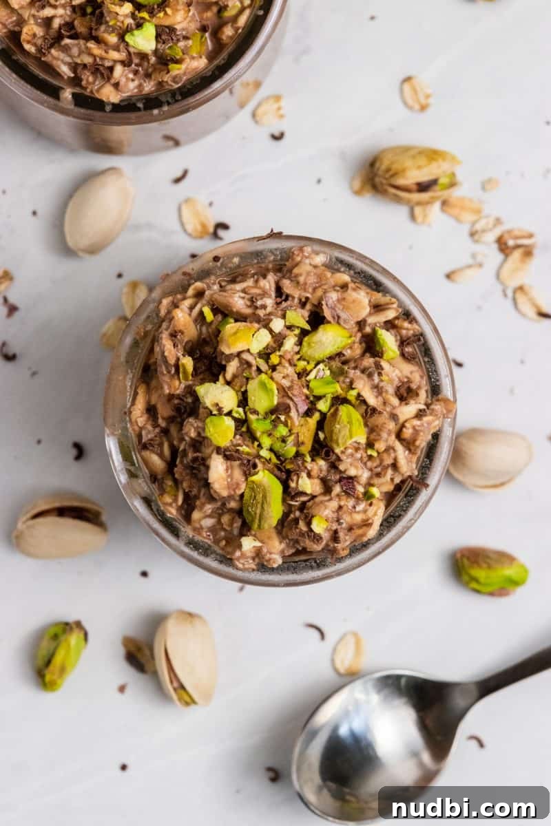 Chocolate Pistachio Overnight Oats Recipe for Creamy Make-Ahead Breakfast 3 Overhead view of oatmeal with spoon.