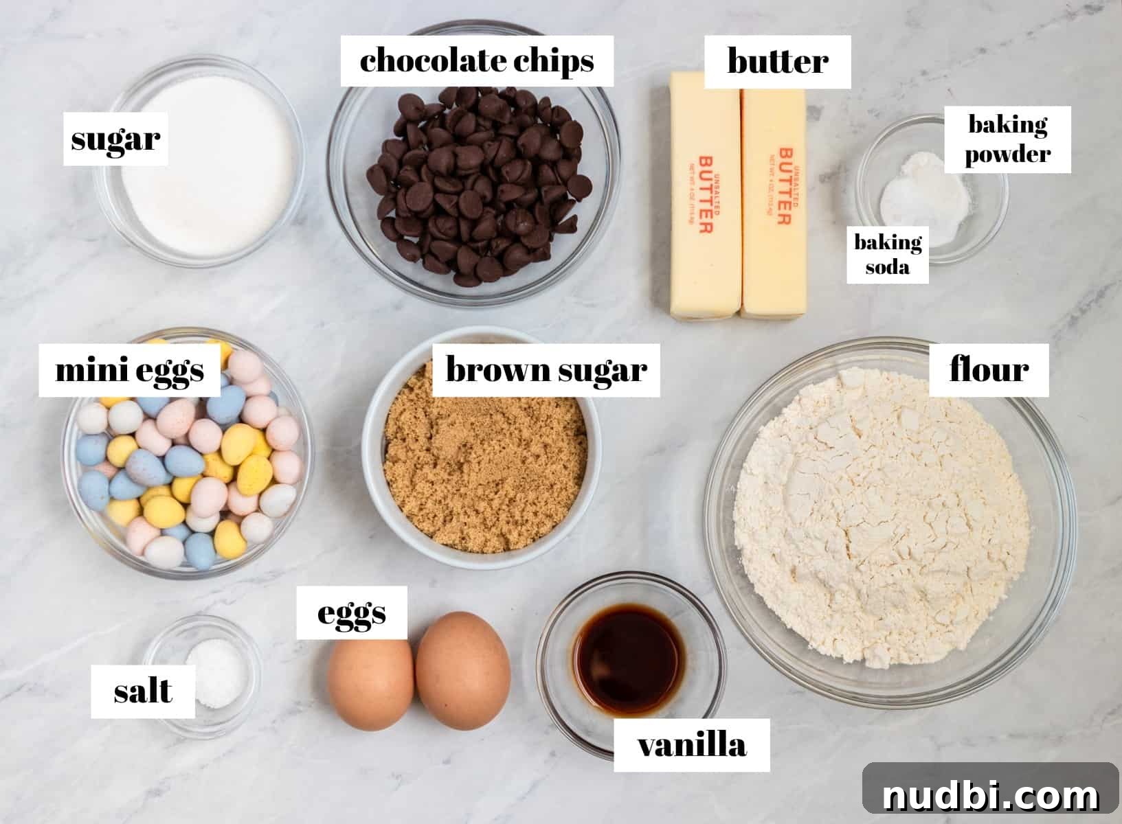 Mini Egg Cheesecake Cookie Bars Recipe for Spring Desserts 3 Flour, eggs, chocolate chips and other ingredients labeled on counter.