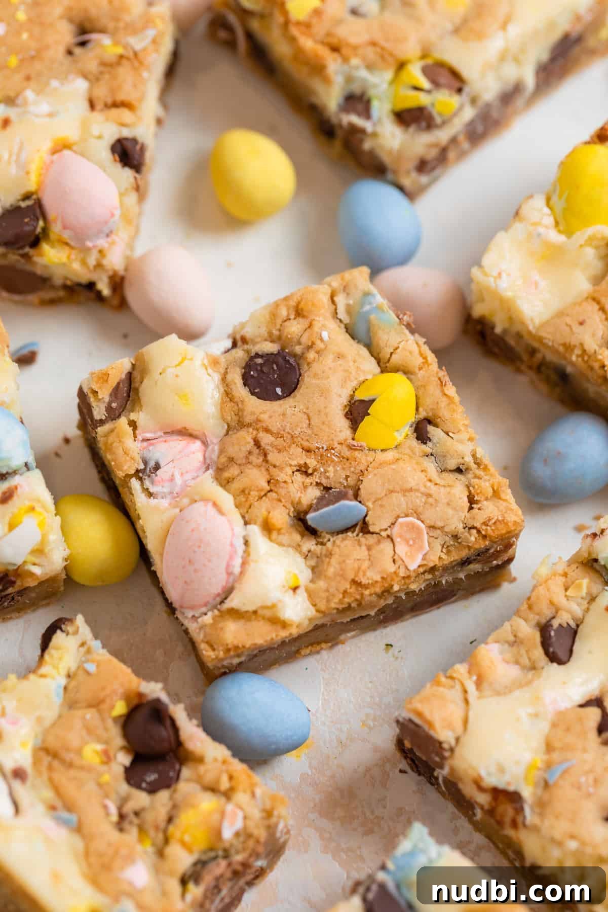 Mini Egg Cheesecake Cookie Bars Recipe for Spring Desserts 9 Mini egg cheesecake cookie bars sliced on counter.