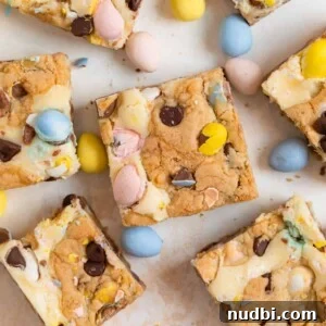Mini Egg Cheesecake Cookie Bars Recipe for Spring Desserts 10 Easter mini egg bars arranged on counter with other mini eggs.