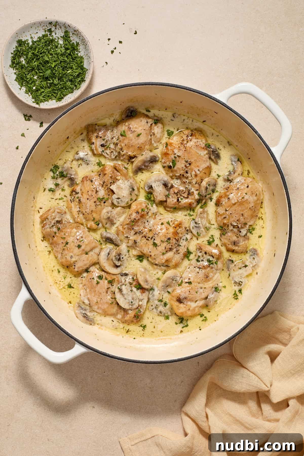 Creamy Mushroom Chicken Thighs with Garlic and Herbs 9 Parsley sprinkled over top of chicken and cream of mushroom sauce.