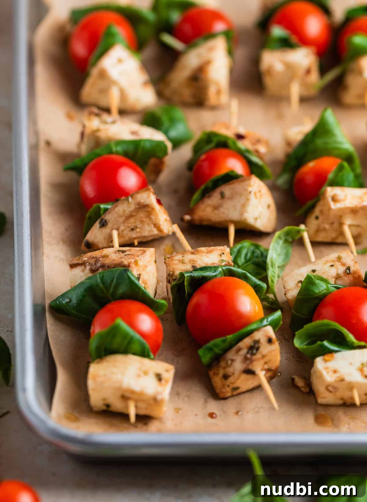 Marinated Mozzarella, Tomato & Basil Skewers for Entertaining 7 Tray with caprese salad skewers using marinated mozzarella.