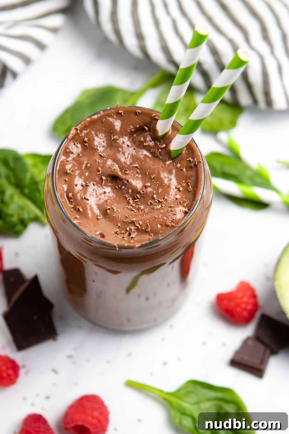 Chocolate Raspberry Avocado Smoothie Recipe for Creamy Antioxidant Boost 2 Chocolate raspberry smoothie in glass with chocolate shavings.