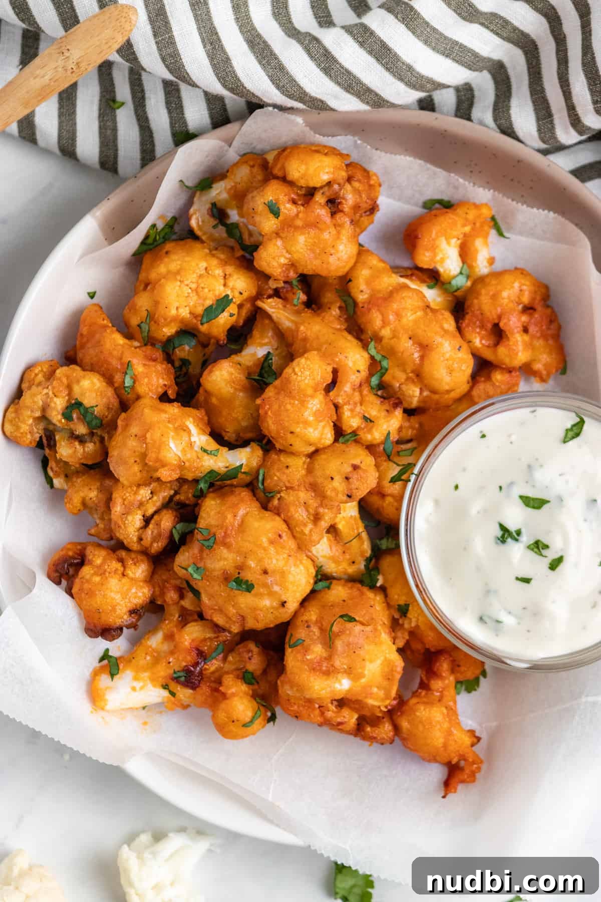 Crispy Air Fryer Buffalo Cauliflower Bites 7 Overhead view of air fryer buffalo cauliflower with dip.