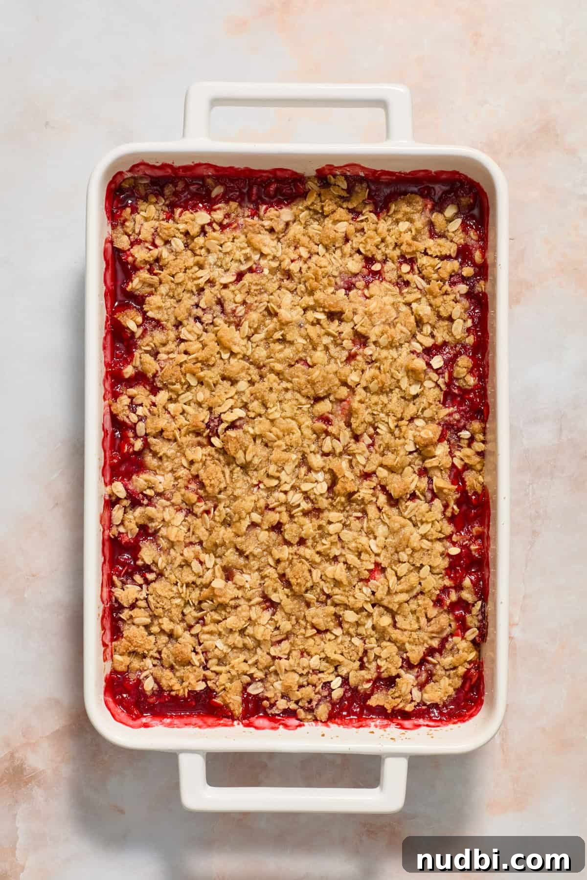 Strawberry Crumble Recipe with Buttery Oat Topping 10 Strawberry crumble in baking dish just after being baked.
