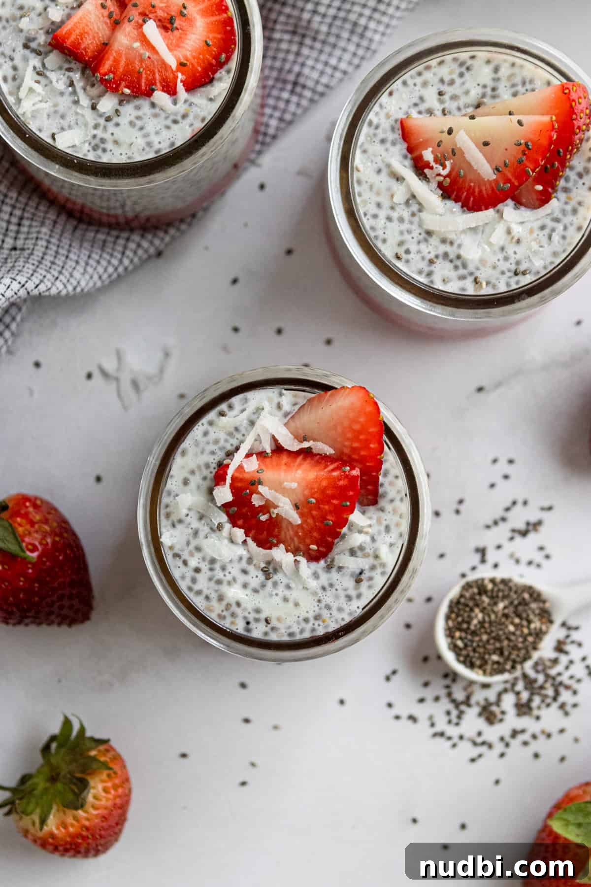 Coconut Vanilla Chia Pudding with Fresh Strawberries 6 Overhead photo of coconut vanilla pudding with berries in jar.
