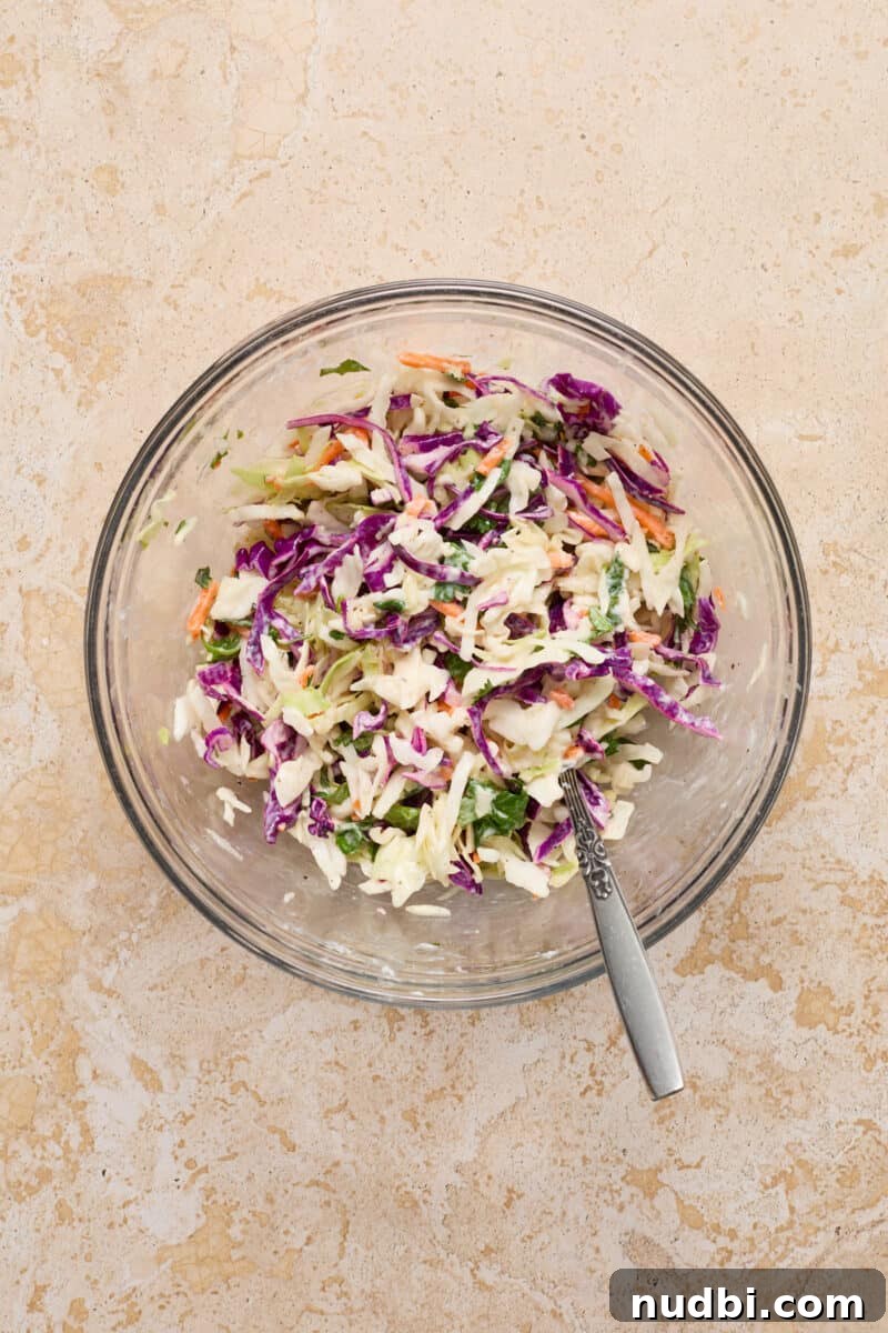 Crispy Air Fryer Fish Tacos with Cilantro-Lime Slaw 8 Cilantro lime slaw in bowl with spoon.
