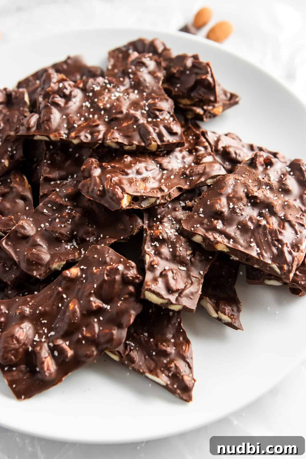 Sea Salt Dark Chocolate Almond Bark Thins Recipe 3 Copycat Bark Thins on white plate.