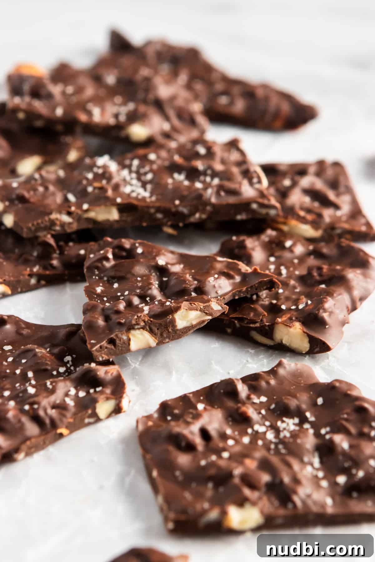 Sea Salt Dark Chocolate Almond Bark Thins Recipe 7 Close up of chocolate almond bark thins with sea salt.