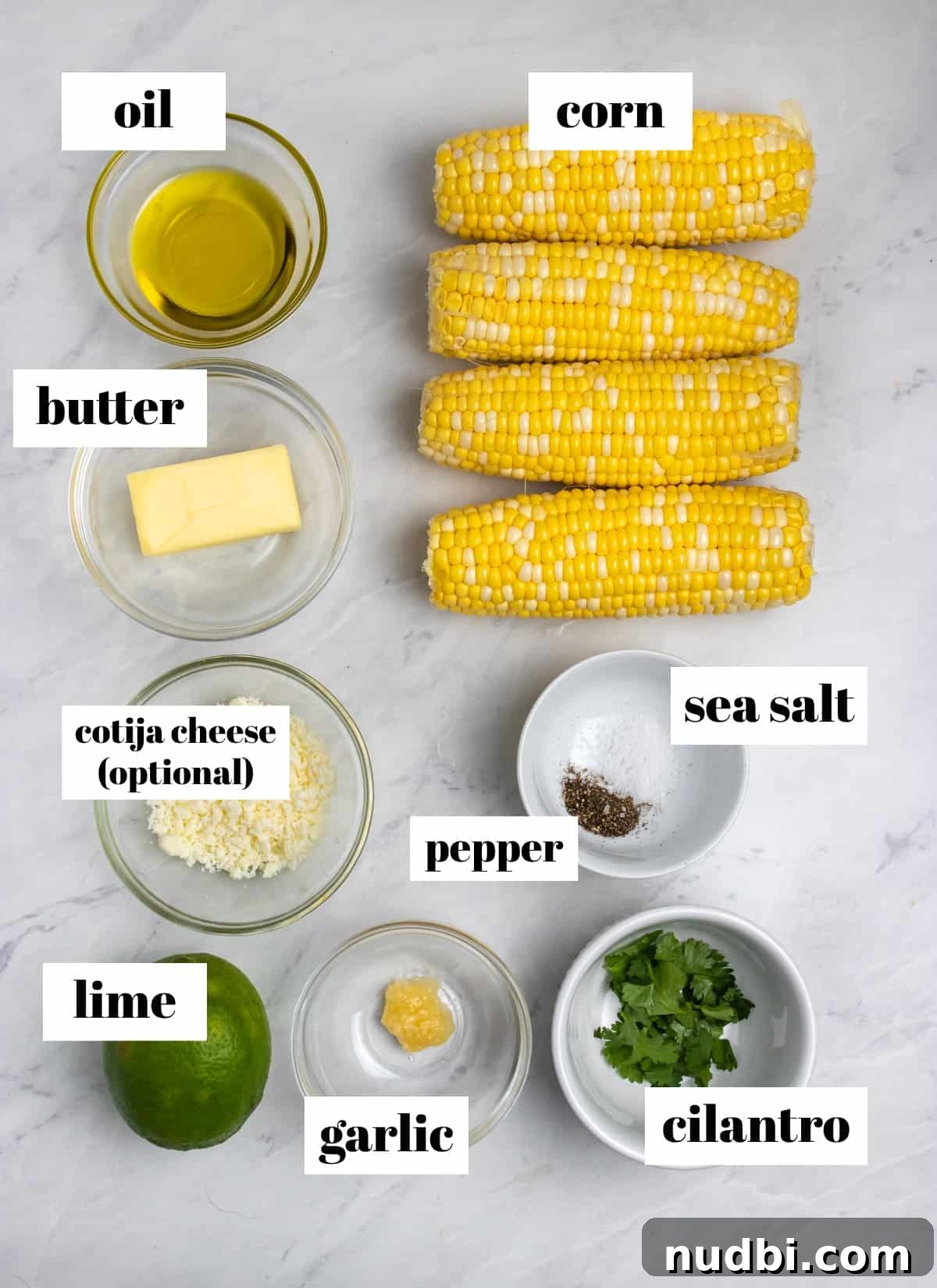 Cilantro Lime Butter Corn on the Cob (Air Fryer Recipe) 3 Corn, butter, cilantro, oil and other ingredients labeled on counter.