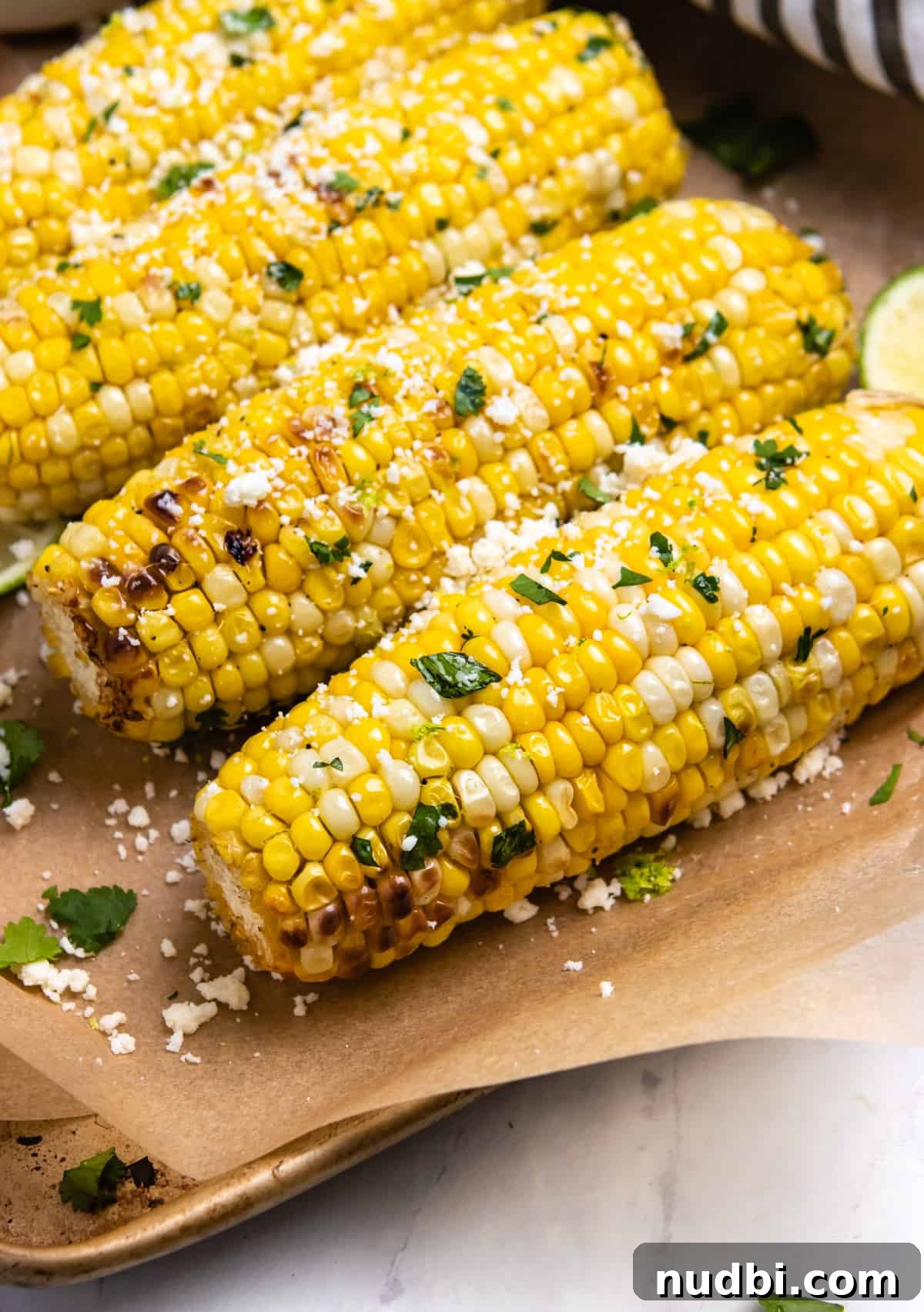 Cilantro Lime Butter Corn on the Cob (Air Fryer Recipe) 6 Air fried corn with butter and cilantro.