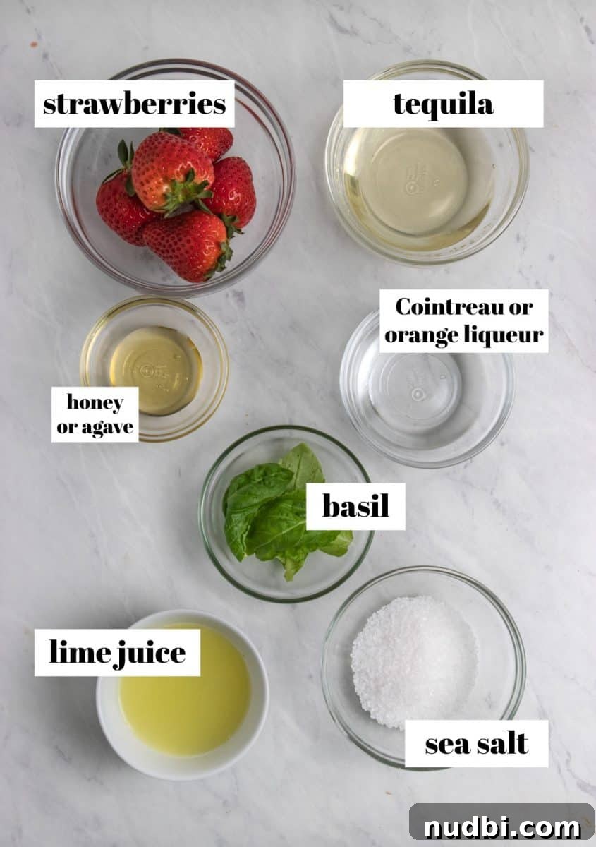 Strawberry Basil Margarita Recipe: Fresh, Tangy Cocktail Guide 3 Strawberries, basil, sea salt, honey and other ingredients to make cocktail.