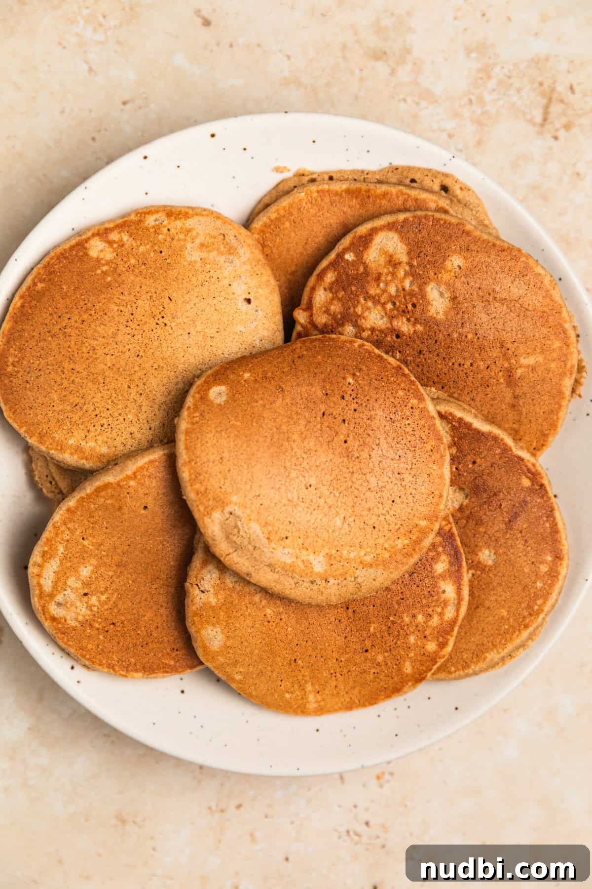 Apple Cinnamon Oatmeal Pancakes Recipe: Fluffy, Whole-Grain Breakfast 11 Apple oat pancakes on plate.
