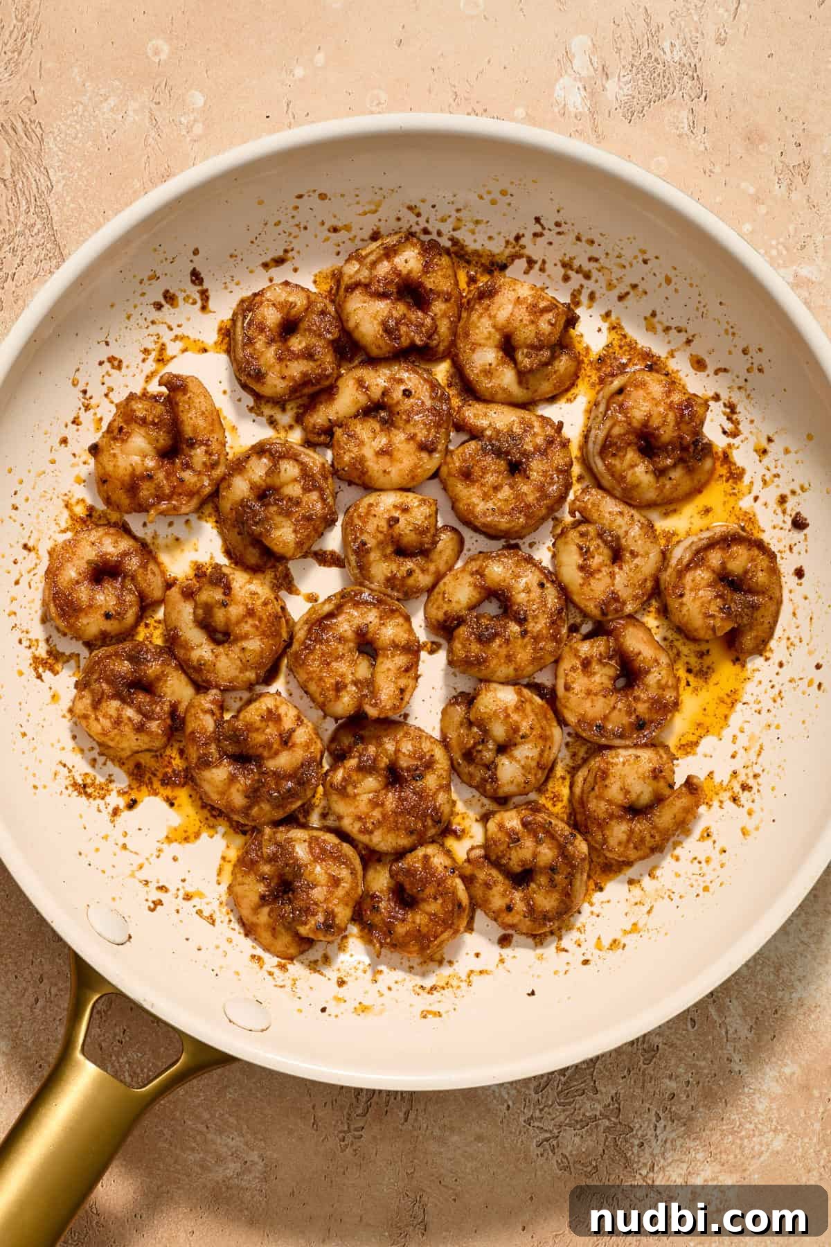 Mango Salsa Shrimp Tacos with Lime Crema 8 Cooked shrimp in skillet for tacos.