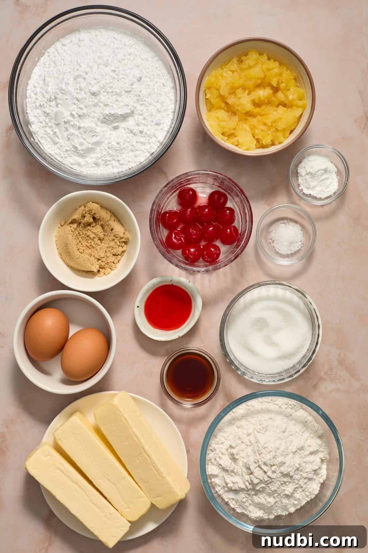 Pineapple Cupcakes with Cherry Buttercream Frosting 3 Crushed pineapple, eggs, butter, flour and other ingredients for recipe.